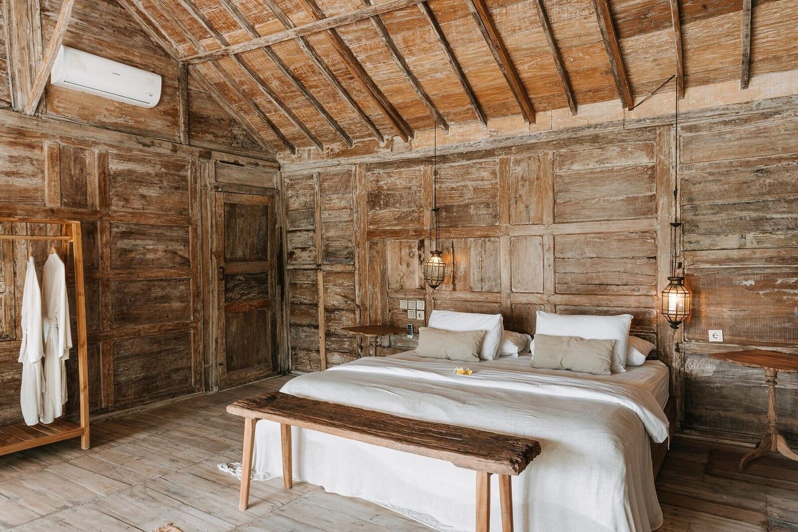 Standard bungalow bedroom with carved wooden walls