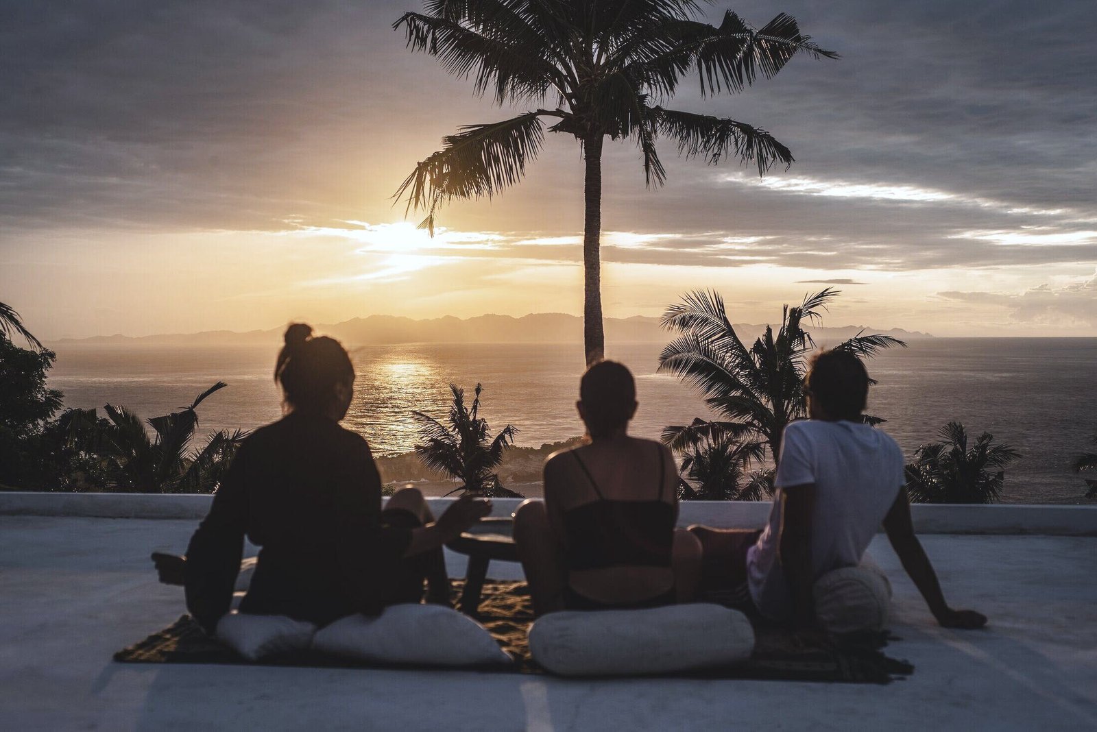Guests watching the sunrise over Lombok from the terrace